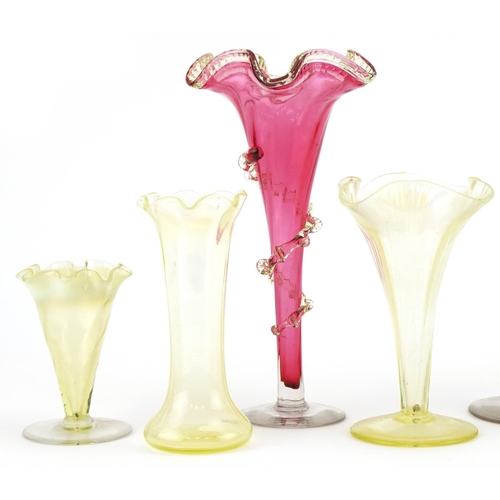 290 - Vaseline glass to include fluted and cranberry glass vases, the largest 30cm high