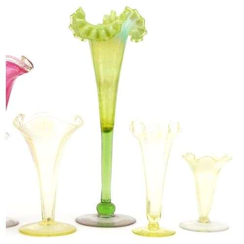 290 - Vaseline glass to include fluted and cranberry glass vases, the largest 30cm high