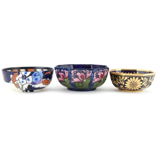 377 - Three Charlotte Rhead for Bursley Ware floral bowls numbered 1550, P28 and 913 to the bases, the lar... 