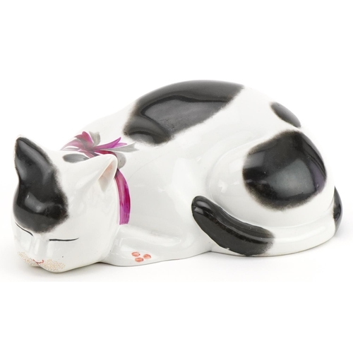 2109 - Fornasetti-Milano, Italian hand painted pottery sleeping cat, paper labels to the base, 30cm in leng... 