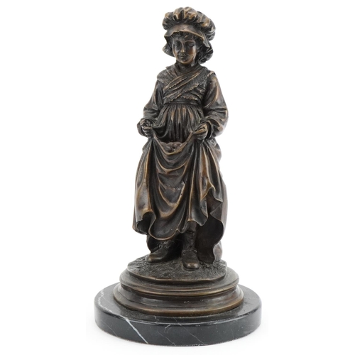 1003 - Bronze figure of a young Dutch female carrying fruit in a dress, raised on a black marble base, 26cm... 