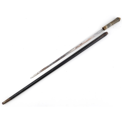 1323 - Indian ebony and bone inlaid swordstick with lion head pommel, 92cm in length