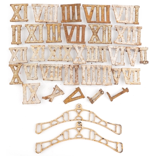 2329 - Collection of Victorian cast iron Roman numeral markers and a pair of clothes airer brackets, the la... 