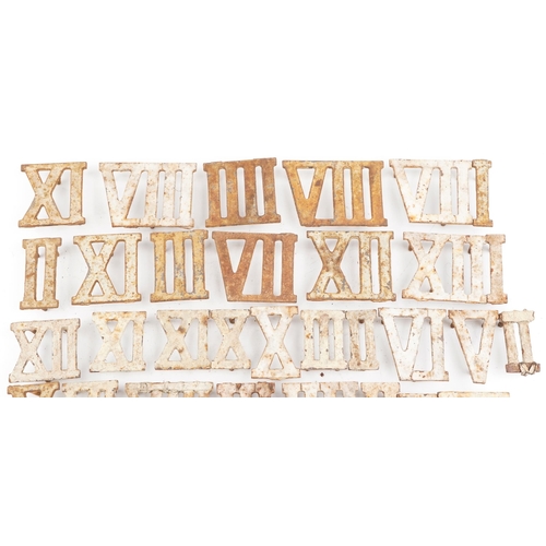 2329 - Collection of Victorian cast iron Roman numeral markers and a pair of clothes airer brackets, the la... 