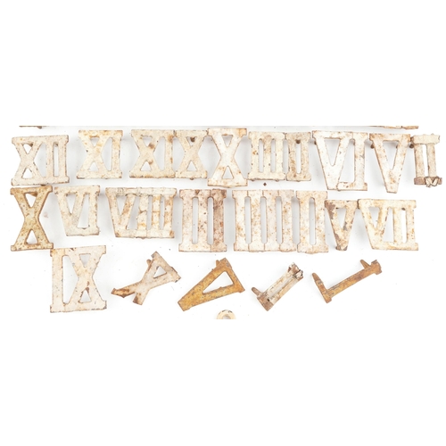 2329 - Collection of Victorian cast iron Roman numeral markers and a pair of clothes airer brackets, the la... 