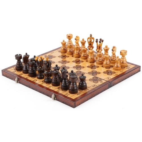 2325 - Drzewiarz carved wooden chess set and folding board, the largest piece 9.5cm high, the board 44.5cm ... 