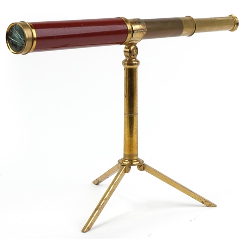 1313 - Dollond & Hutchinson four draw brass telescope mounted on a brass telescope folding stand, each hous... 