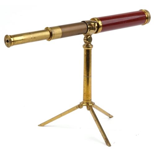 1313 - Dollond & Hutchinson four draw brass telescope mounted on a brass telescope folding stand, each hous... 