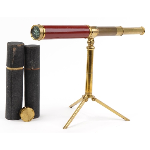 1313 - Dollond & Hutchinson four draw brass telescope mounted on a brass telescope folding stand, each hous... 