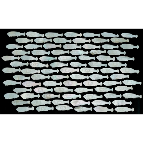 Eighty four mother of pearl fish counters, each 6cm in diameter