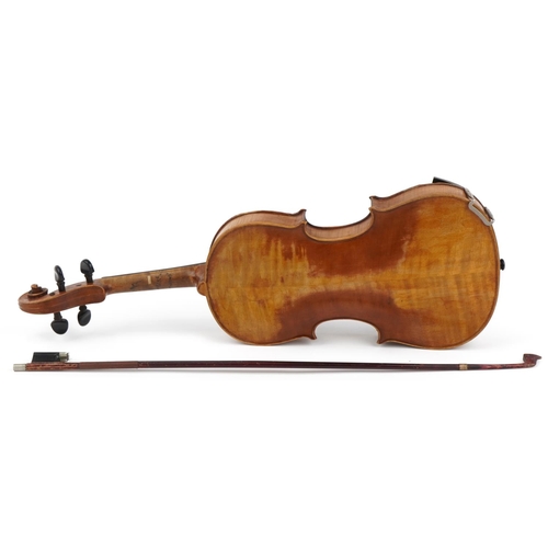 1434 - Old wooden violin with bow and protective carry case, the violin back 14.5 inches in length