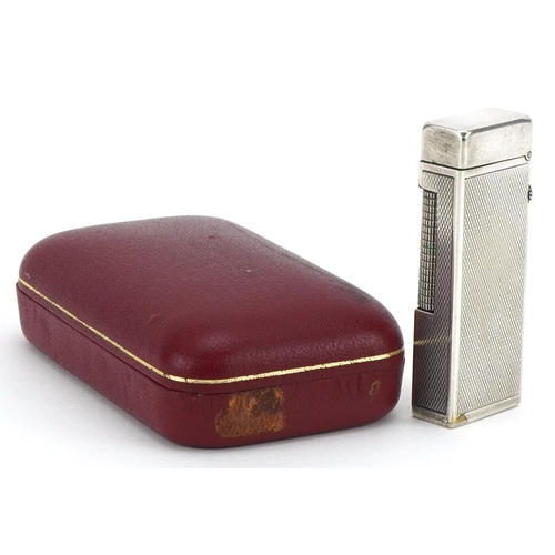 1009 - Dunhill, silver plated pocket lighter with engine turned decoration and case, 6.5cm high