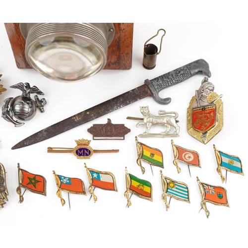 2533 - Militaria including enamel badges, cloth patch, World War II German letter opener and Eveready lamp,... 