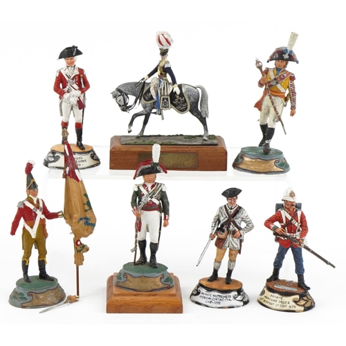 2319 - Seven hand painted model metal soldiers, some with wooden plinth bases, the largest 14cm high