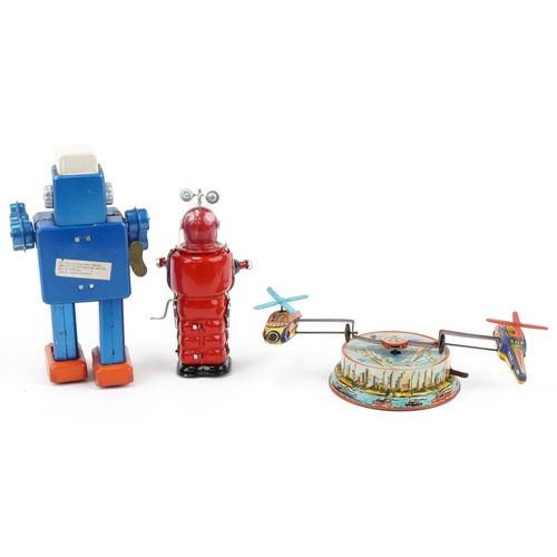 2316 - Three vintage tinplate toys including friction motor Moon Explorer with box and West German helicopt... 