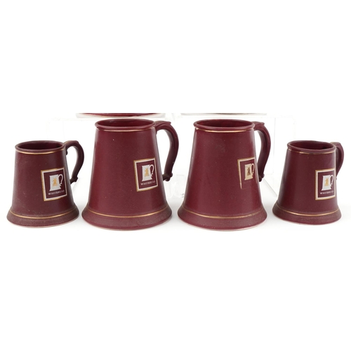 2145 - Six Whitbread burgundy glazed tankards, some by Bretby and Harry E Tunnicliffe Ltd, the largest 19cm... 