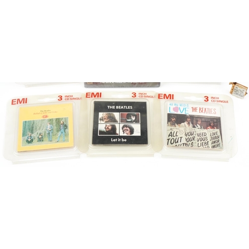 1455 - Beatles memorabilia including vintage folding photo album keyring and 3 inch CD singles