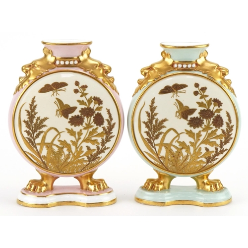 Two Victorian aesthetic Davenport porcelain vases, retailed by Maple & Co, each hand painted and gilded with butterflies amongst flowers and foliage, each 17.5cm high