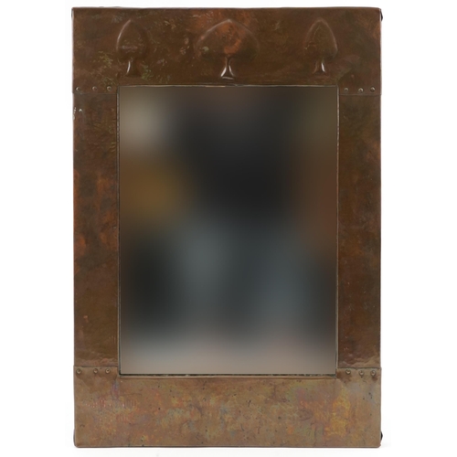 112 - Arts & Crafts copper mirror with stylized top, 66cm x 46cm