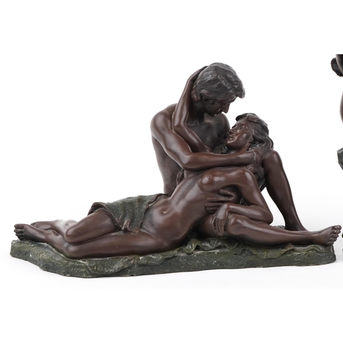 2110 - Three bronzed erotic figure groups of lovers, the largest 28cm high