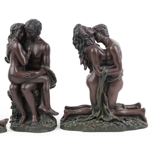 2110 - Three bronzed erotic figure groups of lovers, the largest 28cm high