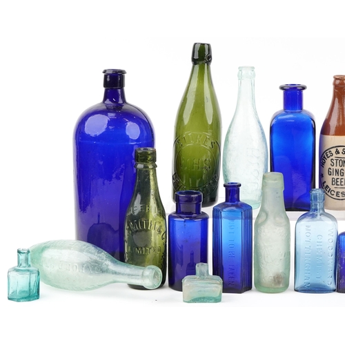 1374 - Collection of antique and later glass and stoneware bottles, some advertising, including Bristol Blu... 