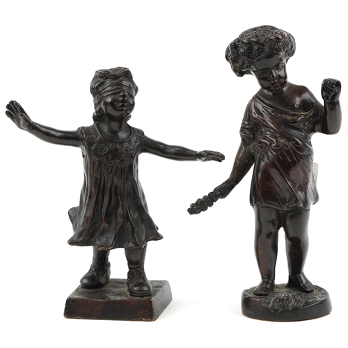 1002 - Two bronze figures of a young boy and girl, the largest 21cm high