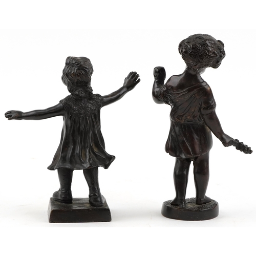 1002 - Two bronze figures of a young boy and girl, the largest 21cm high