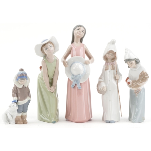 2108 - Five Lladro porcelain figurines including young boy with a polar bear cub, the largest 25cm high