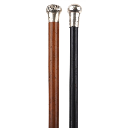 1037 - Two silver handled walking sticks, one malacca and one ebony, the largest 91cm in length