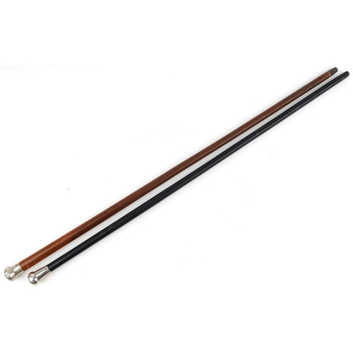 1037 - Two silver handled walking sticks, one malacca and one ebony, the largest 91cm in length