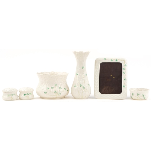 2119 - Belleek Irish porcelain including photo frame, vase and jardinière, the largest 26.5cm high