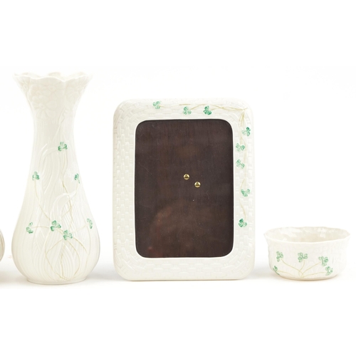 2119 - Belleek Irish porcelain including photo frame, vase and jardinière, the largest 26.5cm high