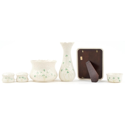 2119 - Belleek Irish porcelain including photo frame, vase and jardinière, the largest 26.5cm high