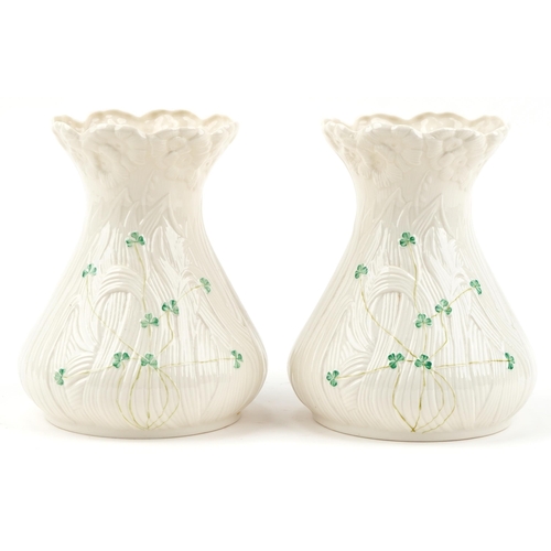 2118 - Pair of Belleek Irish porcelain vases, each 22cm high