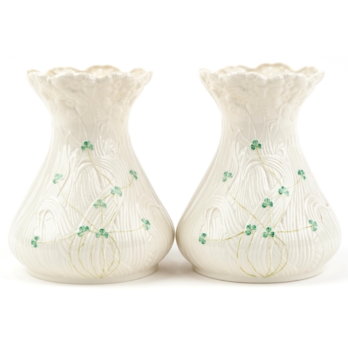 2118 - Pair of Belleek Irish porcelain vases, each 22cm high