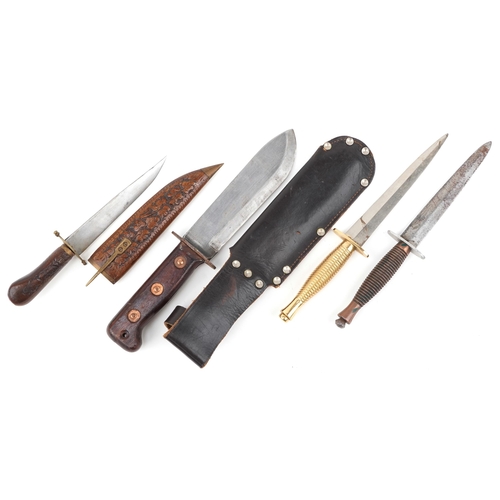 2608 - Four edged weapons including two Fairbairn style fighting knives, the largest 32cm in length