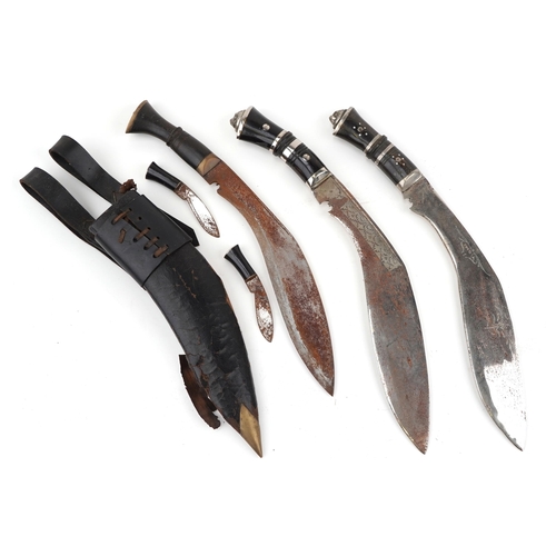 2607 - Three Gurkha's kukri knives, one with leather sheath, each 40cm in length