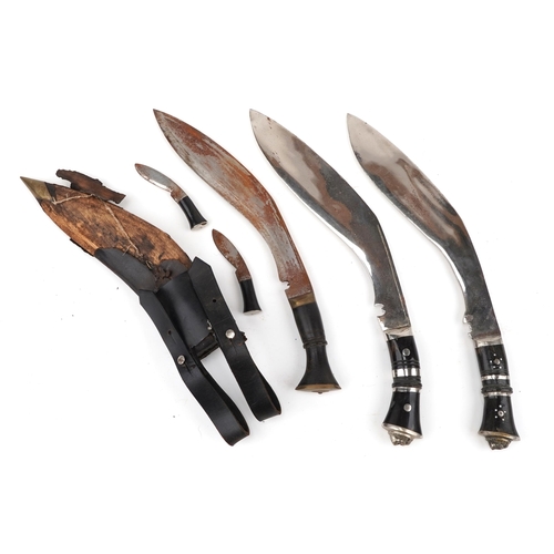 2607 - Three Gurkha's kukri knives, one with leather sheath, each 40cm in length