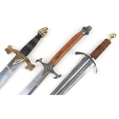 2614 - Three decorative model swords, the largest 100cm in length