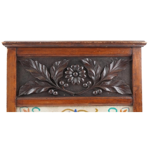 170 - Arts & Crafts carved oak and tapestry fire screen carved with flowers, 80cm x 50cm