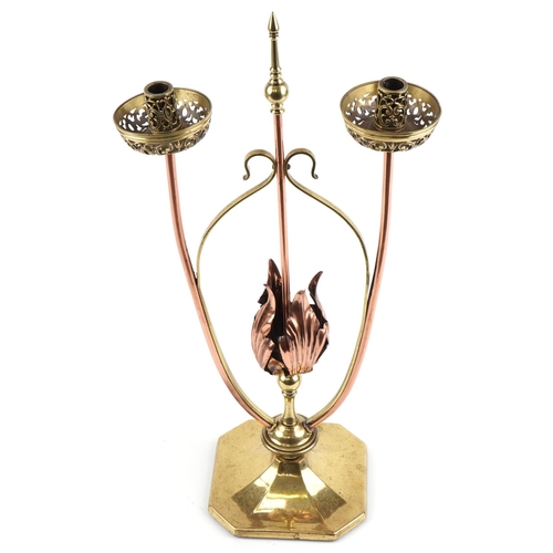 44 - Arts & Crafts copper and brass W.A.S Benson tulip design floor standing twin candlestick, 70cm high