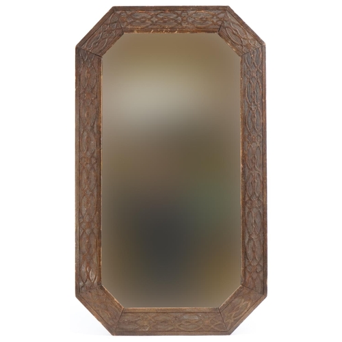 179 - Arts & Crafts oak mirror with stylized border, 79cm x 47cm