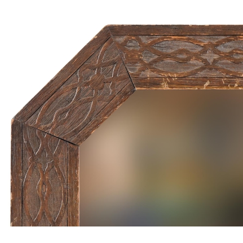 179 - Arts & Crafts oak mirror with stylized border, 79cm x 47cm