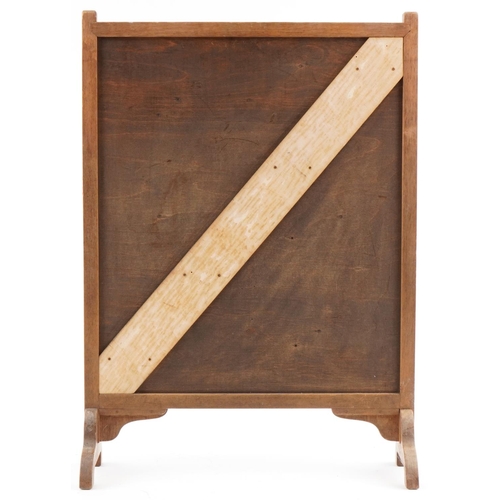 166 - Arts & Crafts oak marquetry panel fire screen with cobbled street scene, 67cm x 50cm