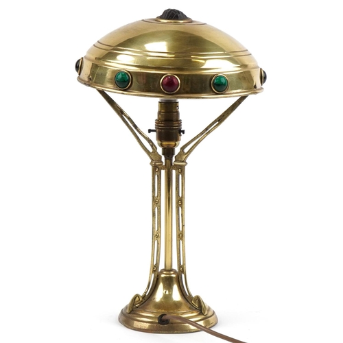 492 - WMF style brass table lamp, the shade set with colourful cabochon glass stones, 37cm high