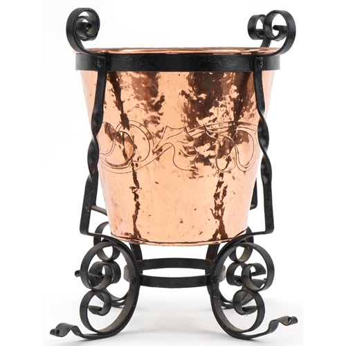 72 - Arts & Crafts copper and wrought iron log bucket with stylized decoration, 46cm high