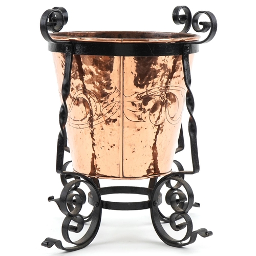 72 - Arts & Crafts copper and wrought iron log bucket with stylized decoration, 46cm high