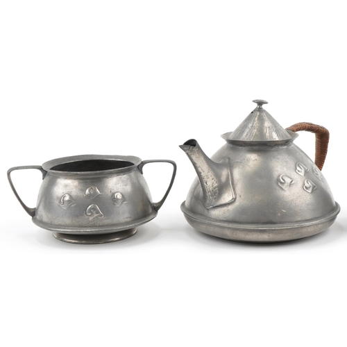 53 - Archibald Knox for Liberty's Tudric pewter tea set, numbered 0303 to the base, the largest 13cm