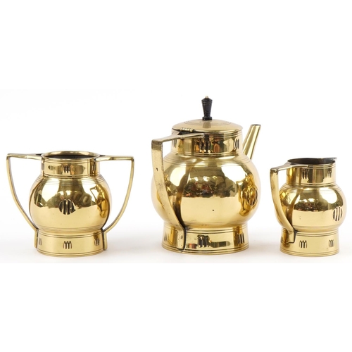 496 - Stylized Dutch three piece brass tea set numbered 216, J A Daaloekcp to the base, the largest piece ... 